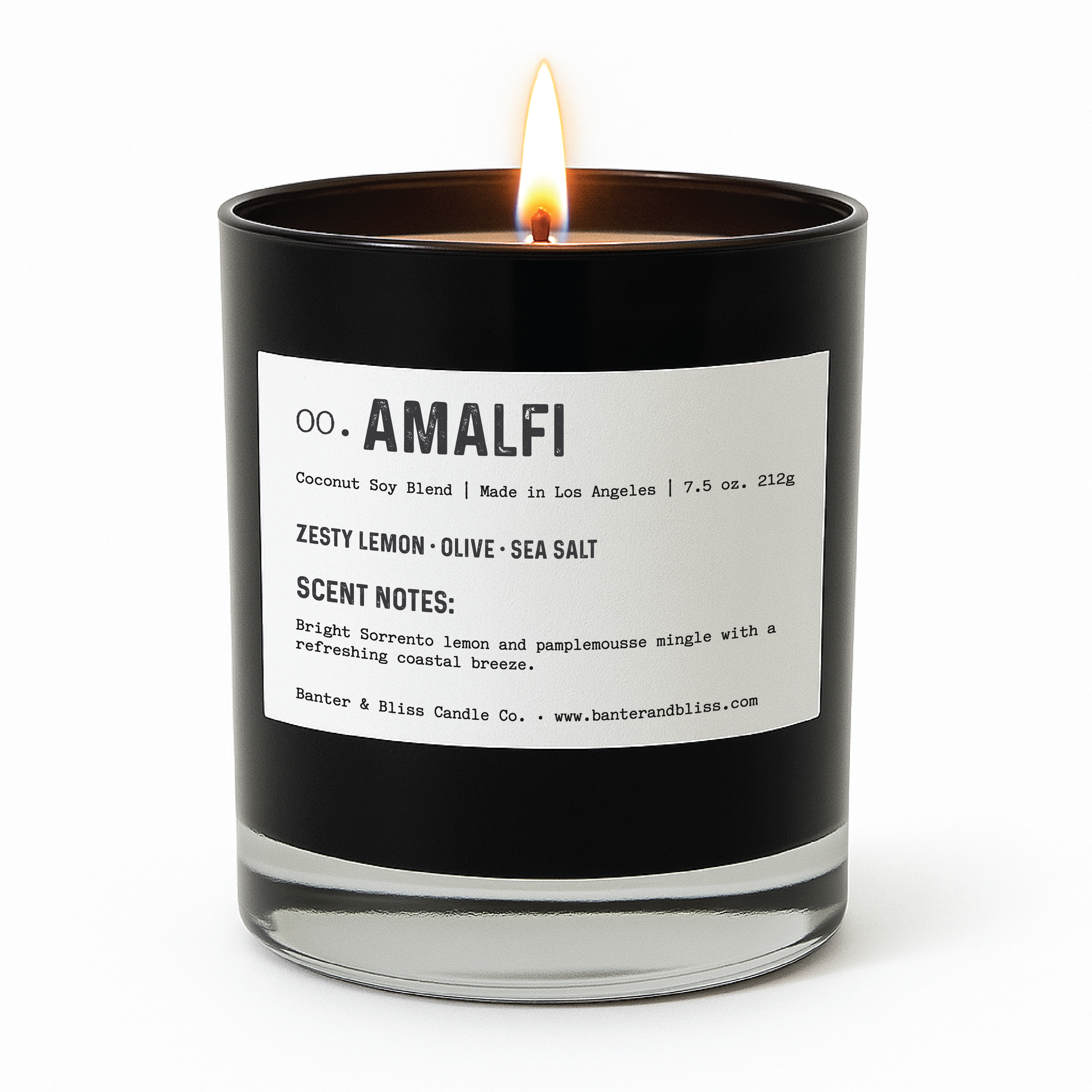 A lit black candle labeled "00. AMALFI" by Banter & Bliss Candle Co. sits on a white background. The label features scent notes of zesty lemon, olive, and sea salt, and includes a description of the fragrance blend.