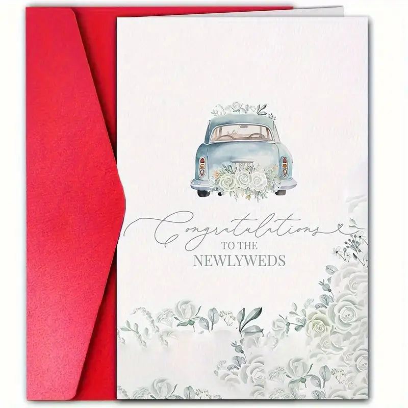 A wedding greeting card placed on top of a red envelope, shown against a white background. The card features a watercolor-style illustration of a vintage blue car decorated with white flowers, along with soft floral accents at the bottom. The elegant script and serif text reads: "Congratulations to the Newlyweds."