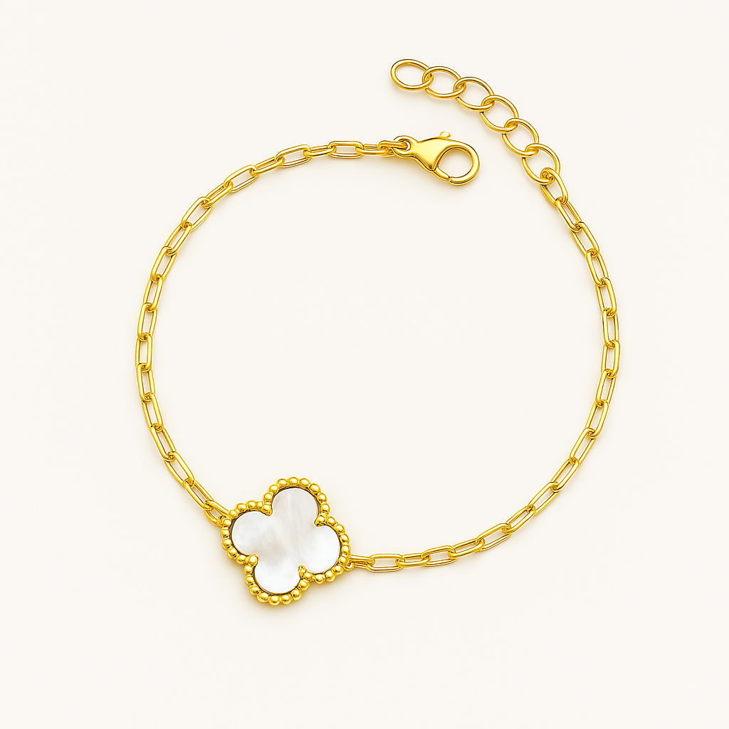 Elegant gold chain bracelet featuring a mother of pearl clover charm with beaded detailing, displayed on a neutral background — luxury women's jewelry accessory.
