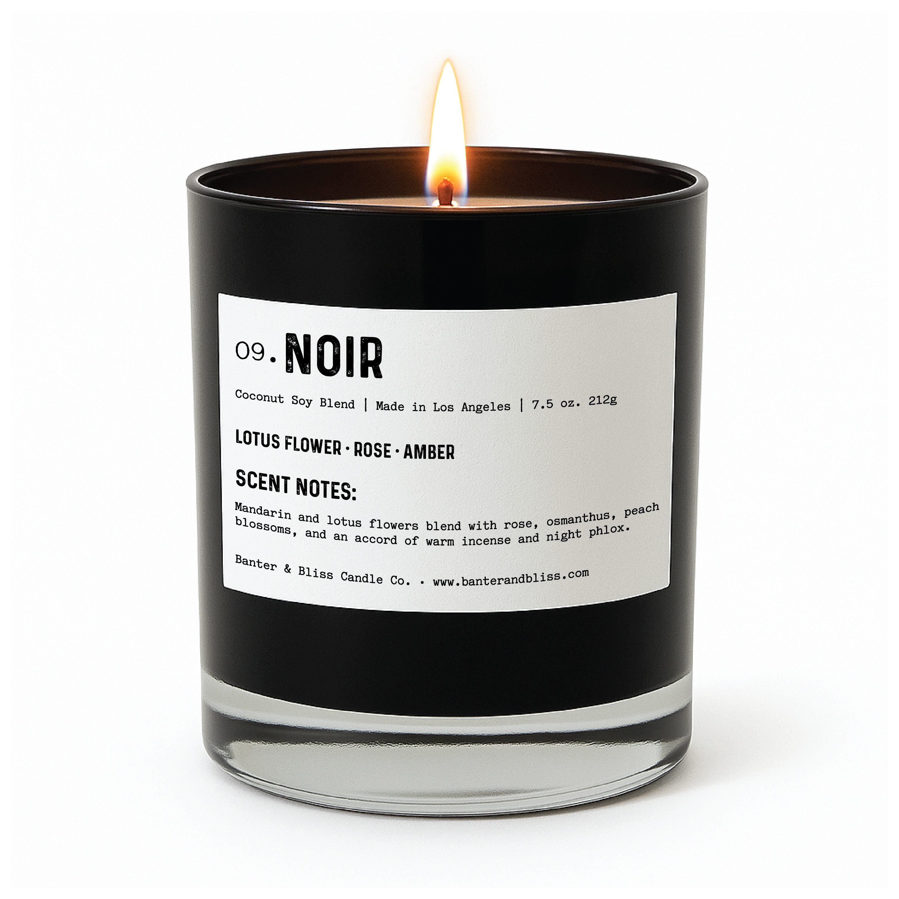 A black glass candle labeled "09. NOIR" from Banter & Bliss Candle Co. is shown burning against a clean white background. The label lists the scent profile: lotus flower, rose, and amber. Detailed scent notes mention mandarin and lotus flowers blended with rose, osmanthus, peach blossoms, warm incense, and night phlox. The minimalist and elegant design highlights the luxury fragrance's sophistication.