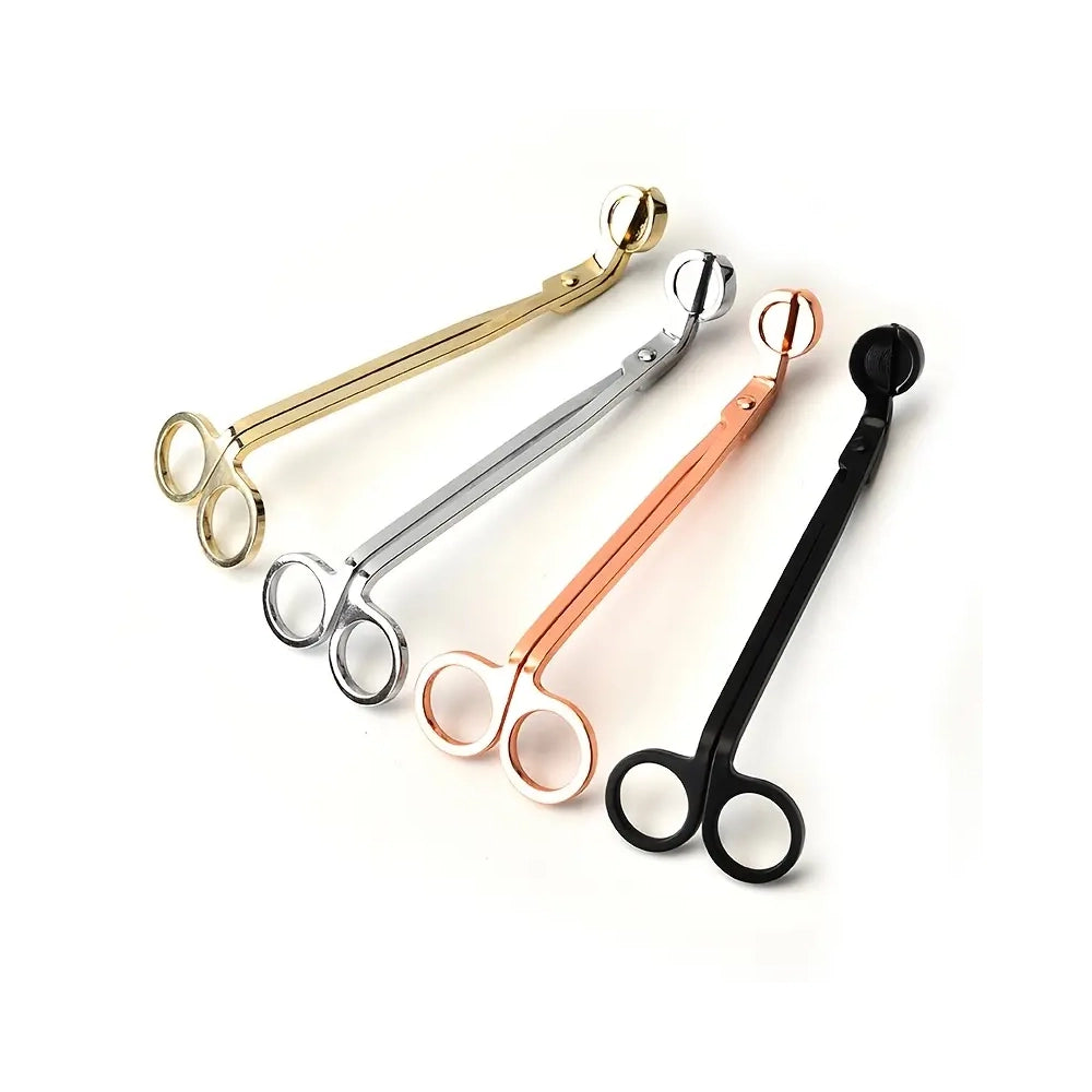 Wick trimmers in four different finishes gold, silver, rose gold, and black.