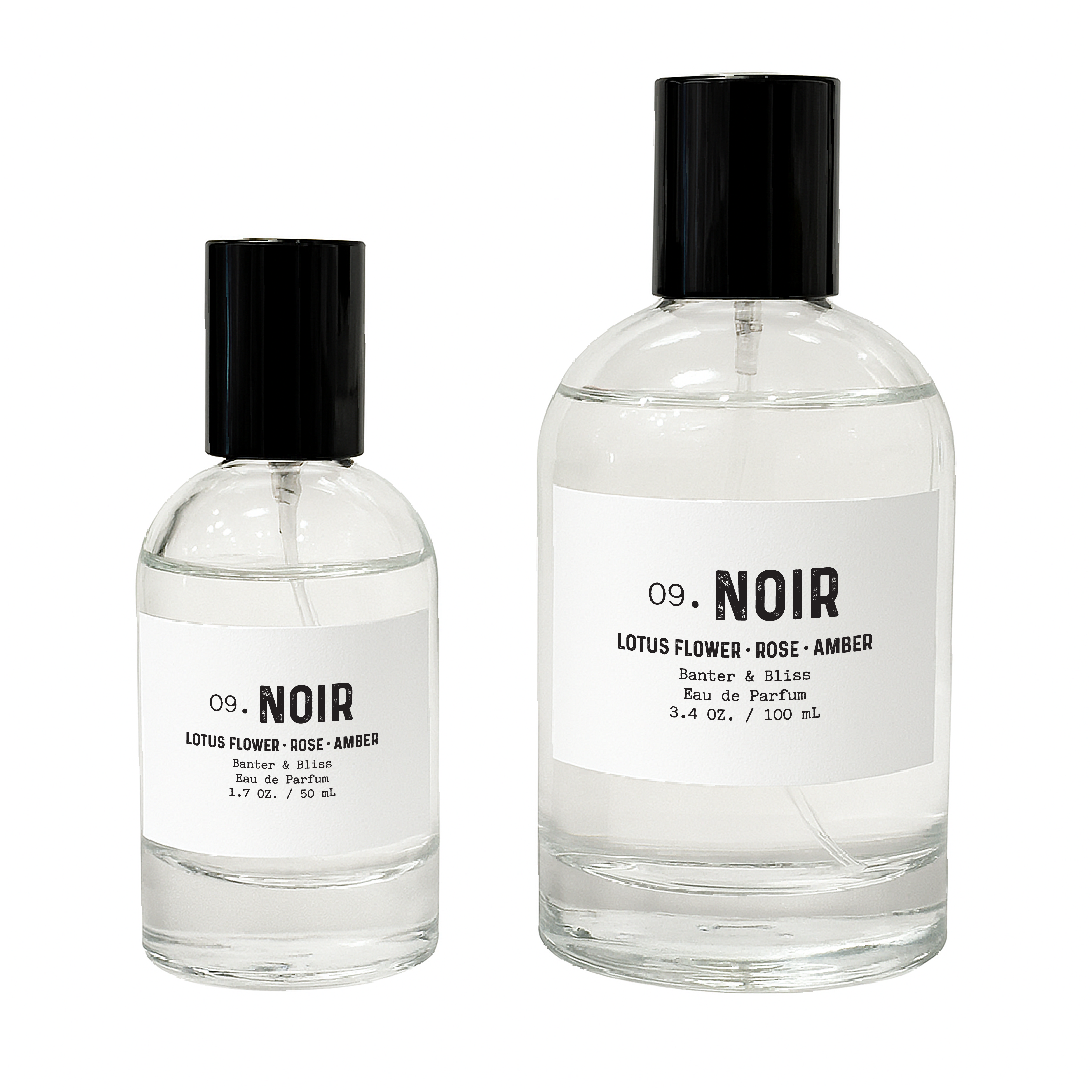 Minimalist product photo of Banter & Bliss Noir Eau de Parfum in 1.7 oz and 3.4 oz clear glass bottles with black caps and white labels, featuring notes of lotus flower, rose, and amber—elegant fragrance photography on white background for luxury perfume product page.