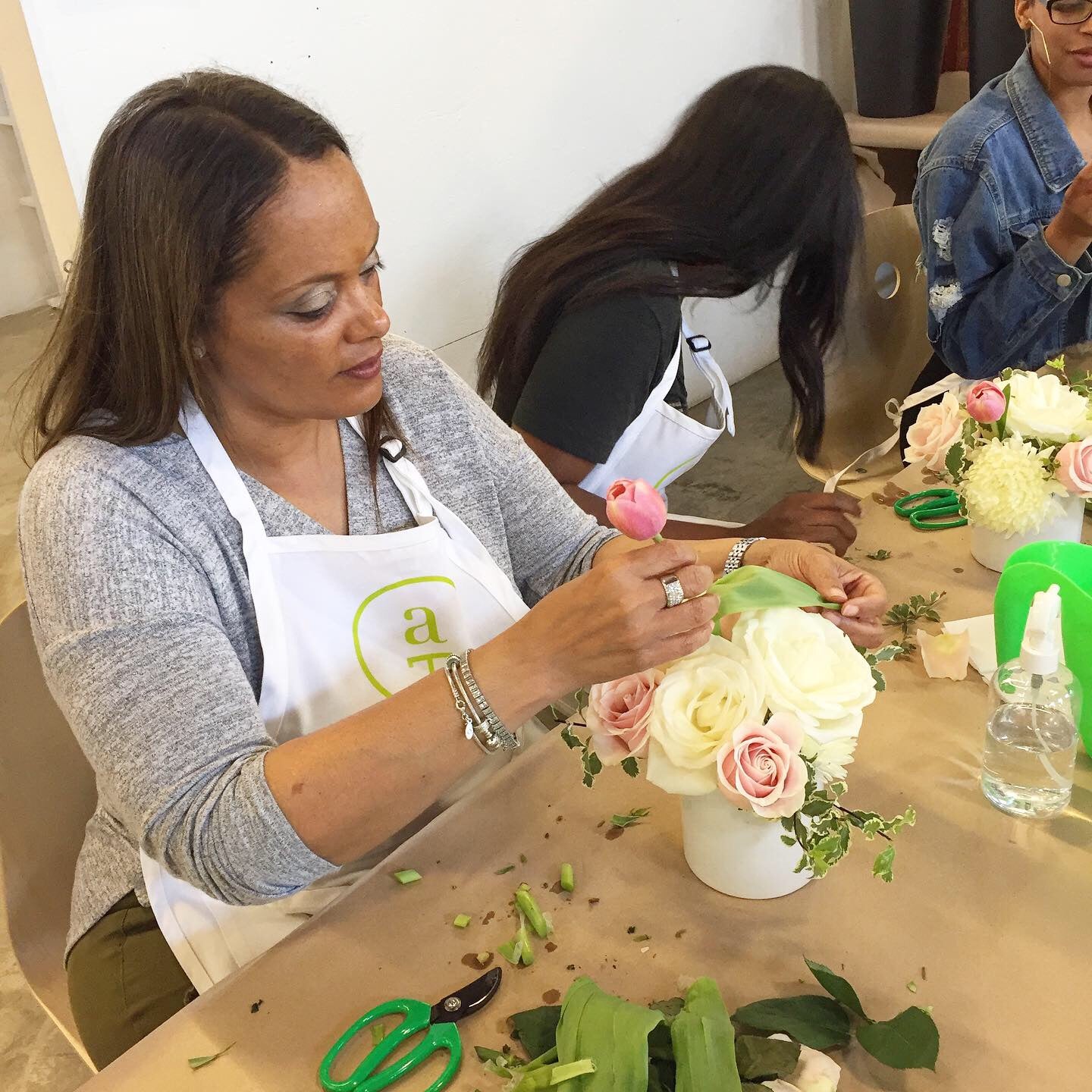 Flower arranging class in session at Banter & Bliss workshop, guests working on their arrangements