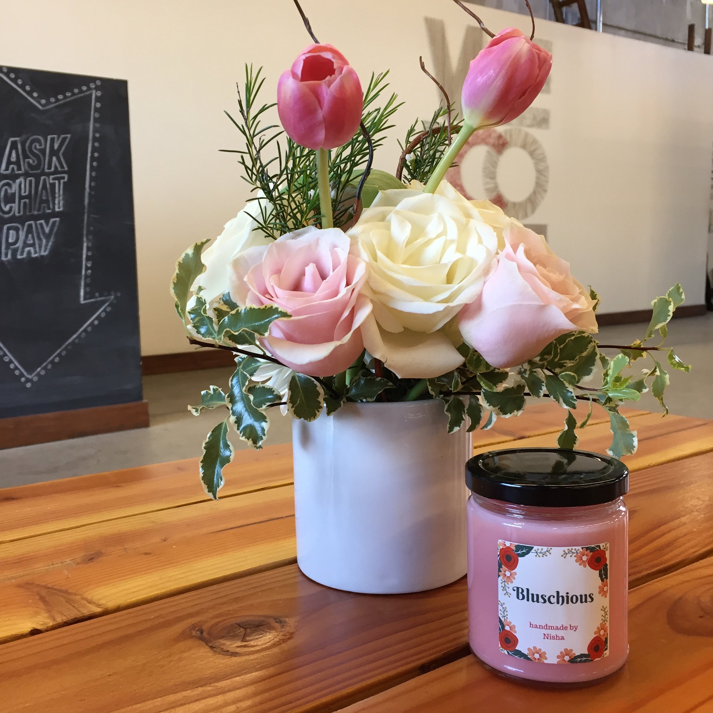 Handmade candle and flower arrangement from a Banter & Bliss workshop