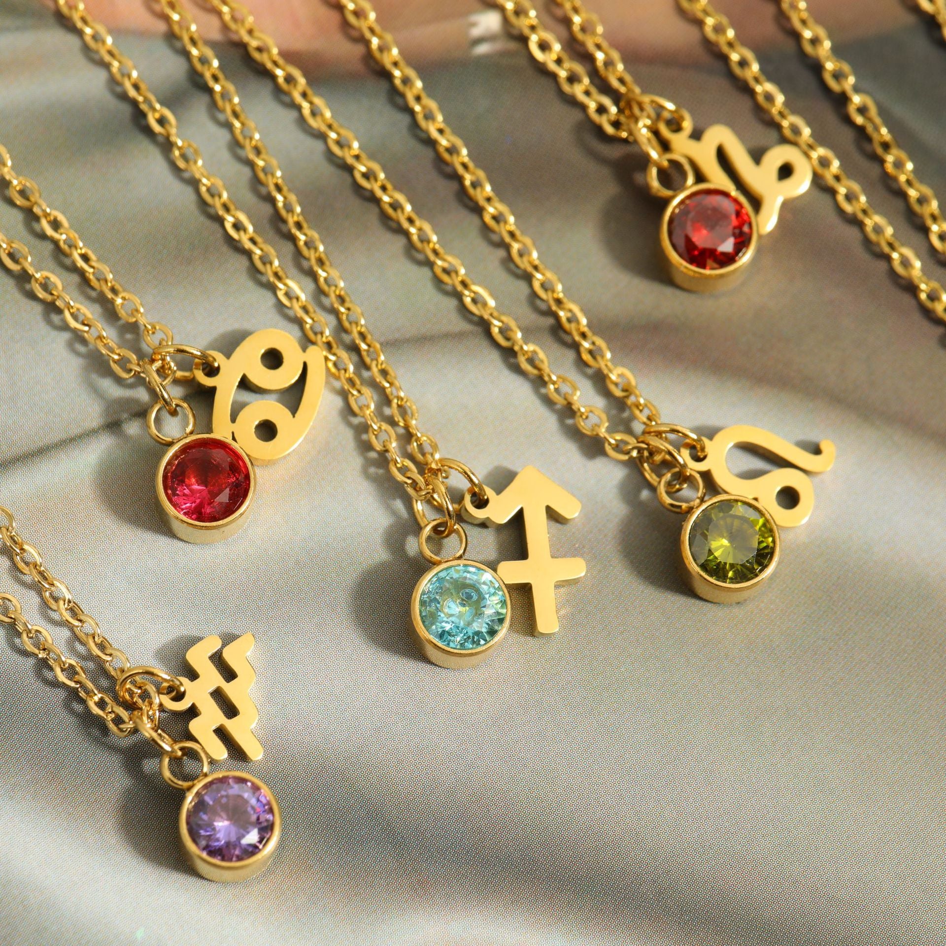Close up of Zodiac Necklaces on Display